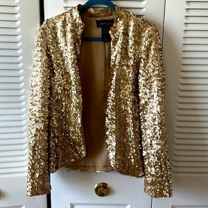 This is a beautiful Sequence Gold blazer